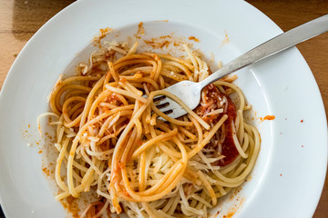 Spaghetti Bolognese with fork in a plate