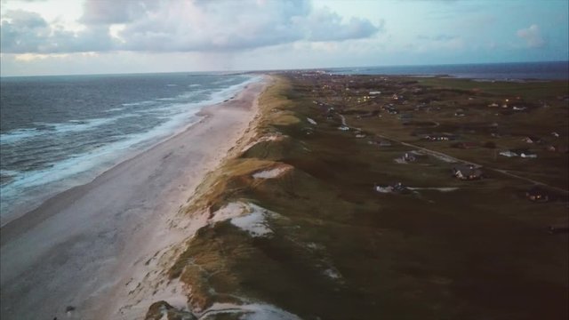 Flying out over the ocean at sundown, looking at Hvide Sande