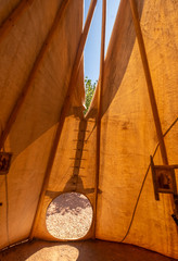 Traditional Ute tipi (teepee) a traditionally made of animal skins and wooden poles with smoke flaps at the top. Utah, USA © Luis