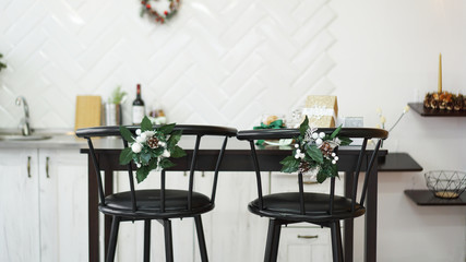 Interior light kitchen with christmas decor and bar chair