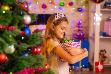 Beautiful ten-year-old girl received a gift from Santa Claus