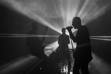 Rock concert silhouette musician. Performance on stage. Song music drive frontman band light guitar...
