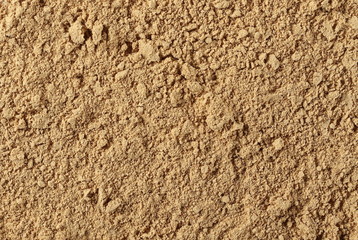 Ginger powder background and texture, top view