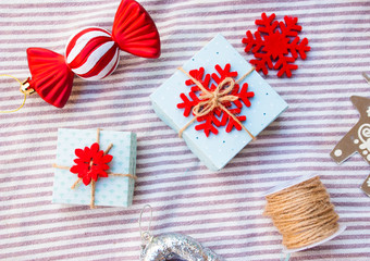 Christmas gift boxes with red decoration. Preparation for new year.