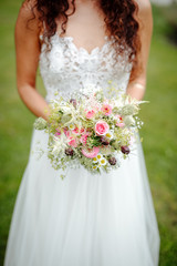 bride holding flowers