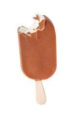 bitten ice cream on a stick in caramel glaze on a white background