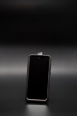 Smartphone with tape covering the phones camera