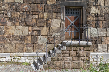 Stone stairs with old wooden doors.