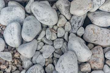 Abstract background with decorative floor pattern of gravel stones, Gravel texture. closeup