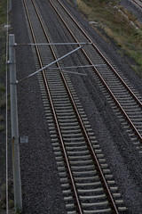 View of train tracks and electric poles