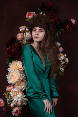 fashion studio portrait of a girl with flowers - 306029541