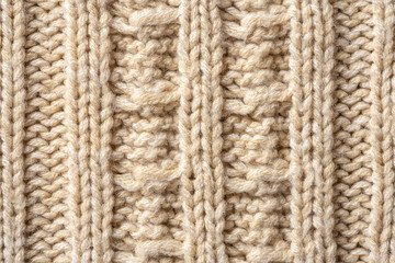Beige Knitwear Fabric Texture with Pigtails. Beige Knitted Background.