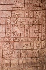 Hieroglyphics etched in a stone wall