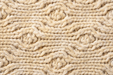 Beige Knitwear Fabric Texture with Pigtails. Beige Knitted Background.