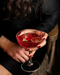 red cocktail with lemon slice