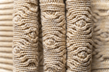 Beige Knitwear Fabric Texture with Pigtails. Beige Knitted Background.