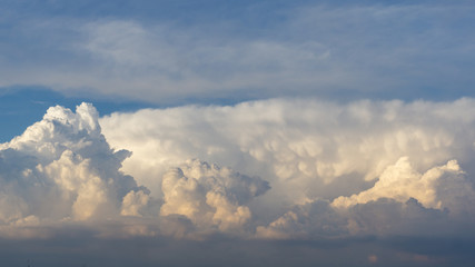 Fototapeta na wymiar dense cloud clusters in blue sky