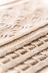 Beige Knitwear Fabric Texture with Pigtails. Beige Knitted Background.