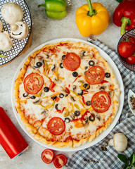 pizza with tomato olives and bell peppers