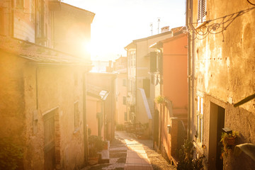 Sun lit streets in Italian coastal town of Tellaro, La Spezia, Italy