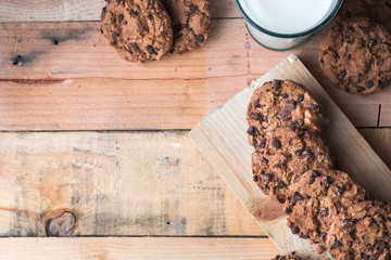 Fototapeta premium Chocolate chip cookies on a wooden background. No people. Concept raw food. Directly above
