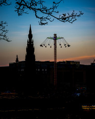 Silhouette of Scott Monument and Christmas Market in Edinburgh Scotland