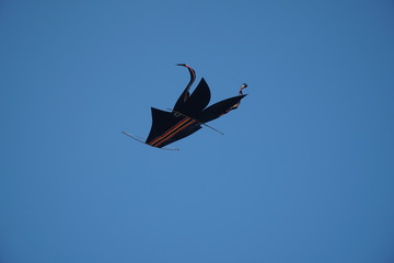 black crafted kite in the sky in bali
