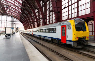 Fototapeta na wymiar Train on railway station, travel in Europe