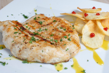  grilled chicken breast and french fries