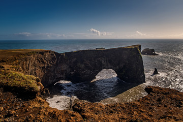 Natural arch of Dyrholaey Peninsula in South Iceland. September 2019