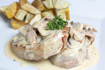 meat in mushroom sauce and french fries