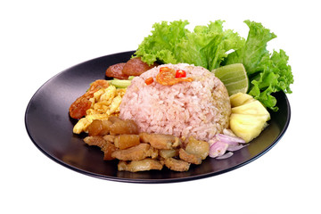Fried rice with shrimp paste (Khao khluk Kapi) isolated on white background, a flavorful dish in Thai cuisine that consists of primary ingredients of fried rice mixed with shrimp paste (Kapi).