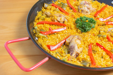  Traditional Spanish paella with different meat, seafood and vegetable ingredients