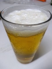 glass of cola with ice on a white background