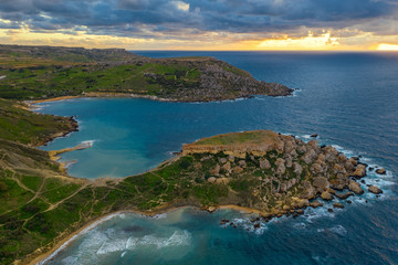 Aerial view of Ghajn Tuffieha Bay. Sunset sky, clouds, sea, winter. Malta 