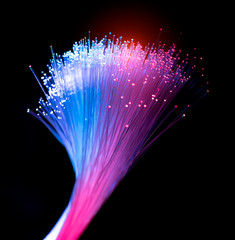 Obraz na płótnie Canvas fiber optics network cable for ultra fast internet communications, thin light threads that move information at high speed.