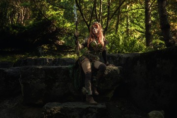 Elven warrior woman in the deep forest