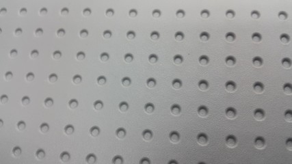 Grey view of colorful plastic woven stripes.