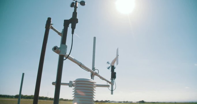 Weather station on research farm measuring moisture and wind 
