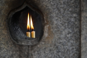 two candles in a japanese shrine