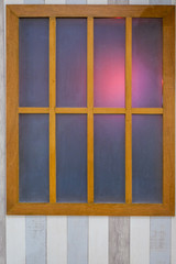 classic wooden window and wood wall pattern With shining orange light.