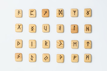 Wooden runes on white background isolate
