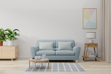 Mock up wall in living room with blue sofa, plants and table on empty white wall background.