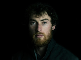 young man on dark background
