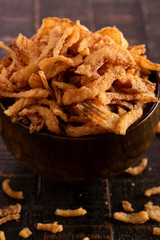 Fried Onions for Green Bean Casserole or Salad Garnish on a Wooden Table