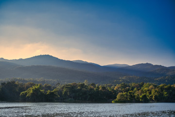 Landscape image of sunset over the mountains and the lake