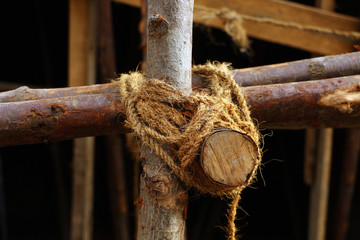 rope with knot on wooden background