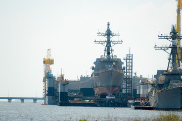 The ship yard of Ingalls Shipbuilding with several military Navy war ships