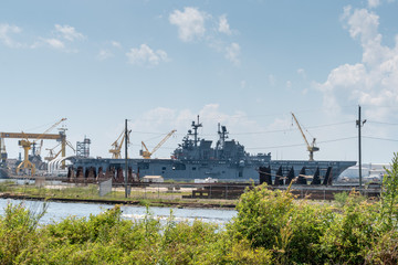 The ship yard of Ingalls Shipbuilding with several military Navy war ships