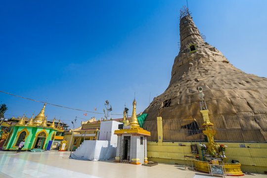 The renovation of the famous Botataung pagoda with blue sky. Located in downtown Yangon, Myanmar, The pagoda is hollow within, and houses what is believed to be a sac